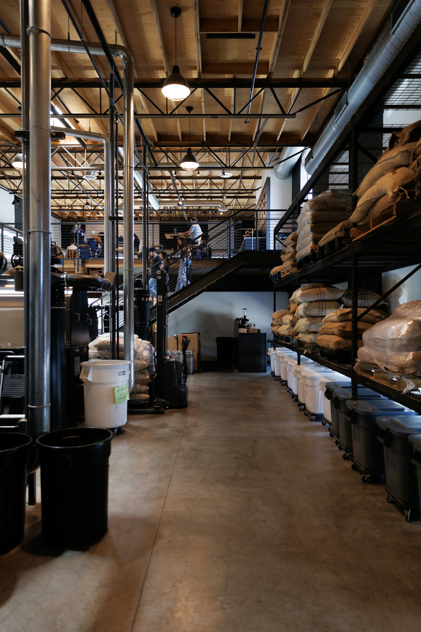 Industrial warehouse with stored commodity containers